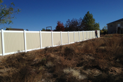 white-top-and-bottom-rail-with-tan-panels-vinyl-fence-installed-in-st-george-ut-scaled