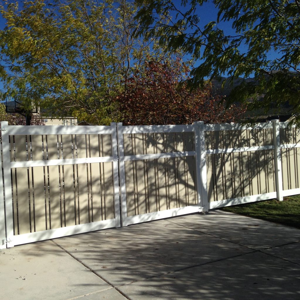 custom vinyl privacy fence installed with slotted panels in st george ut