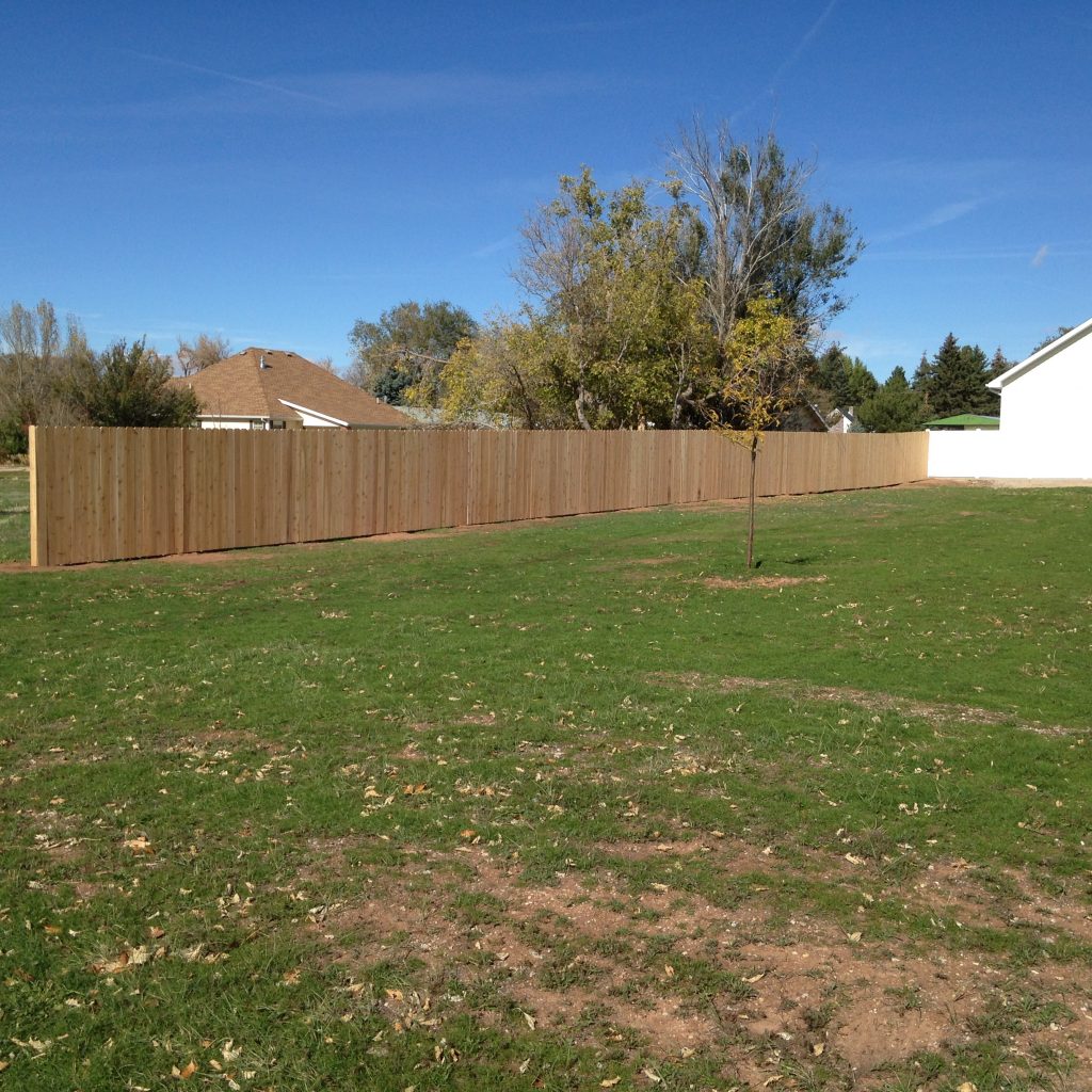 Stained wood privacy fencing installed in backyard Parowan Ut.