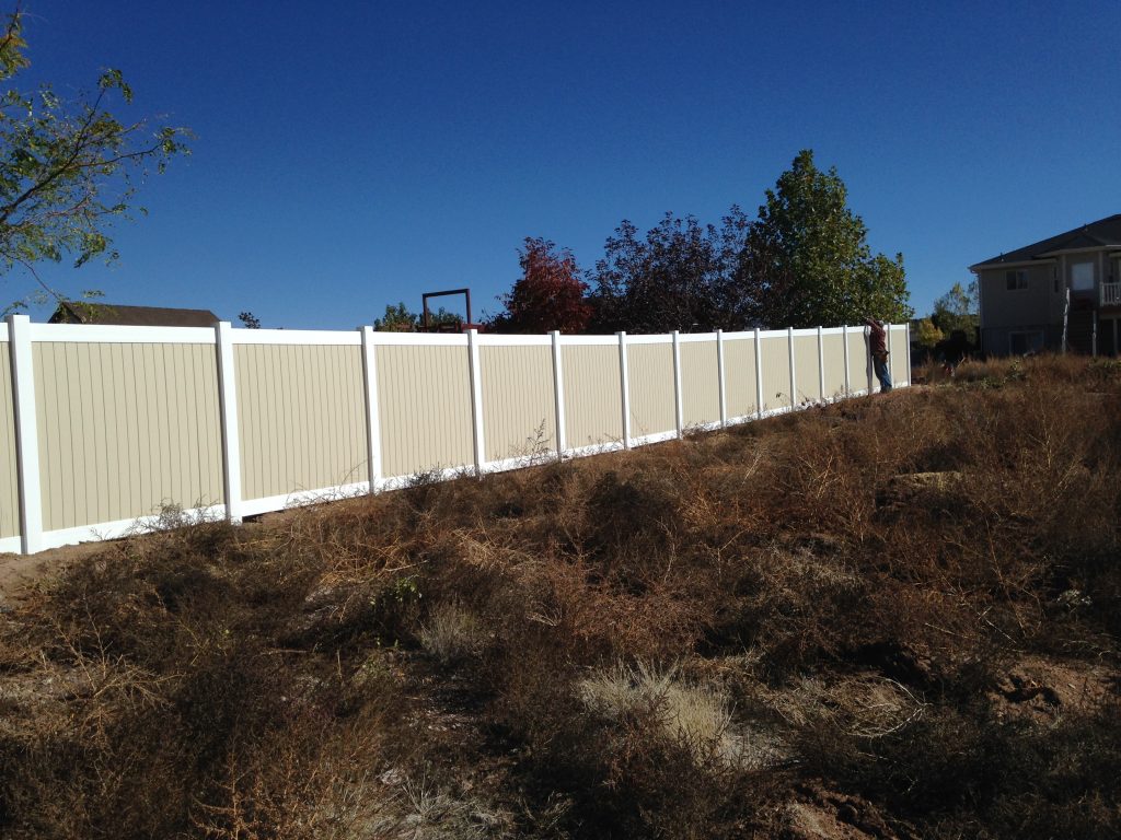 white top and bottom rail with tan panels vinyl fence installed in st. george, ut